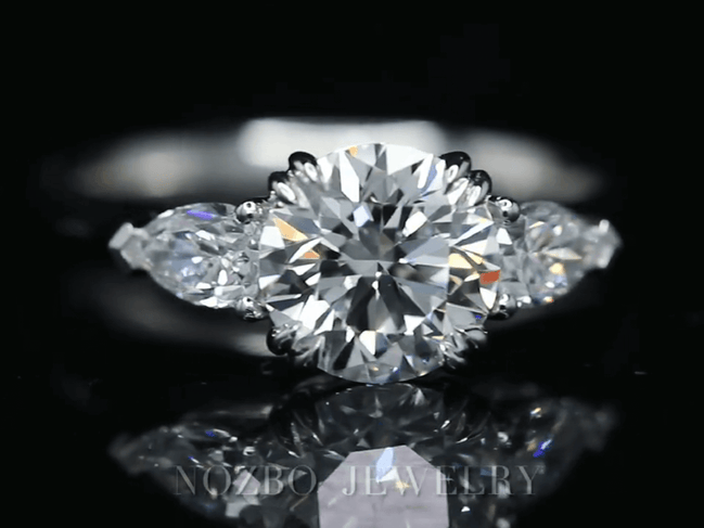 Three-Stone 1 Carat Round Diamond With Pear Side Stones Ring 18K Gold