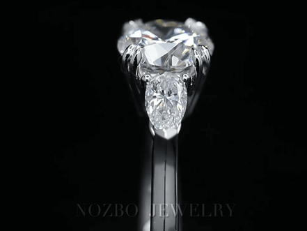 Three-Stone 1 Carat Round Diamond With Pear Side Stones Ring 18K Gold