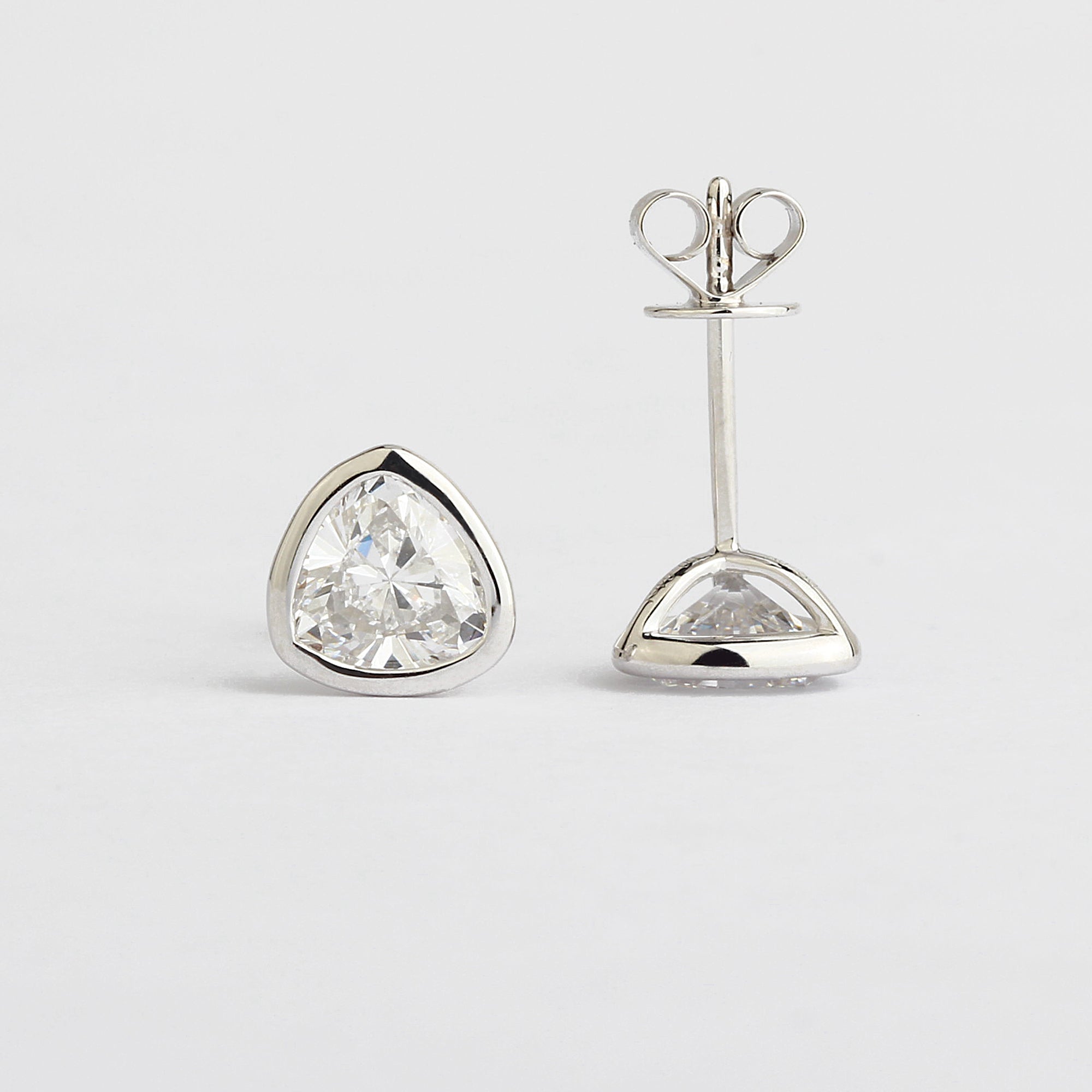 Affordable Luxury Jewelry Bezel Trillion Cut Solitaire Lab-Grown Diamond Studs (1.31 Ct. Tw.)